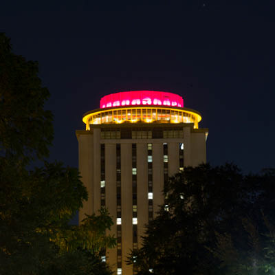 Capstone glowing garnet at night.