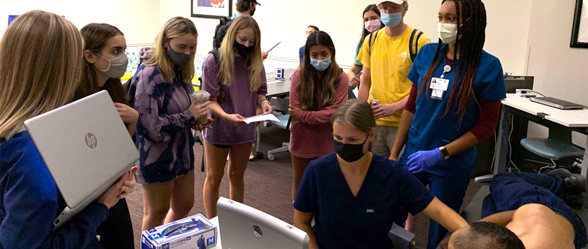 CDVT students watching a scan demonstration 