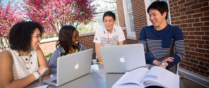 students studying outside school of journalism