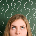 Girl in front of chalkboard