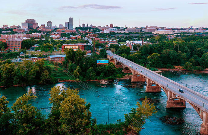 Skyline of downtown Columbia with the Gervais Street Bridge over the river in the foreground.