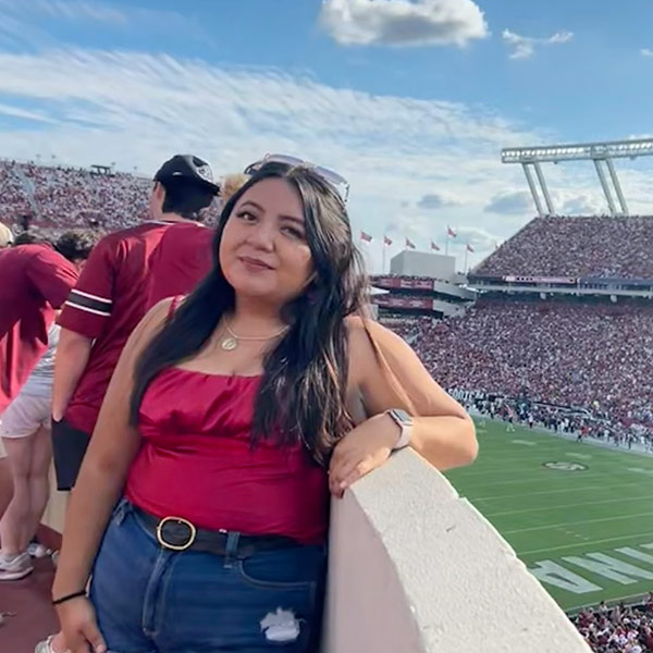 Laura Torres stands on ramp overlookng  Williams-Brice Stadium.