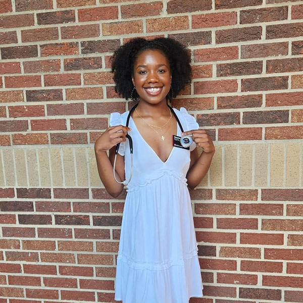 Photo of Hasanna Davis with her nursing stethoscope